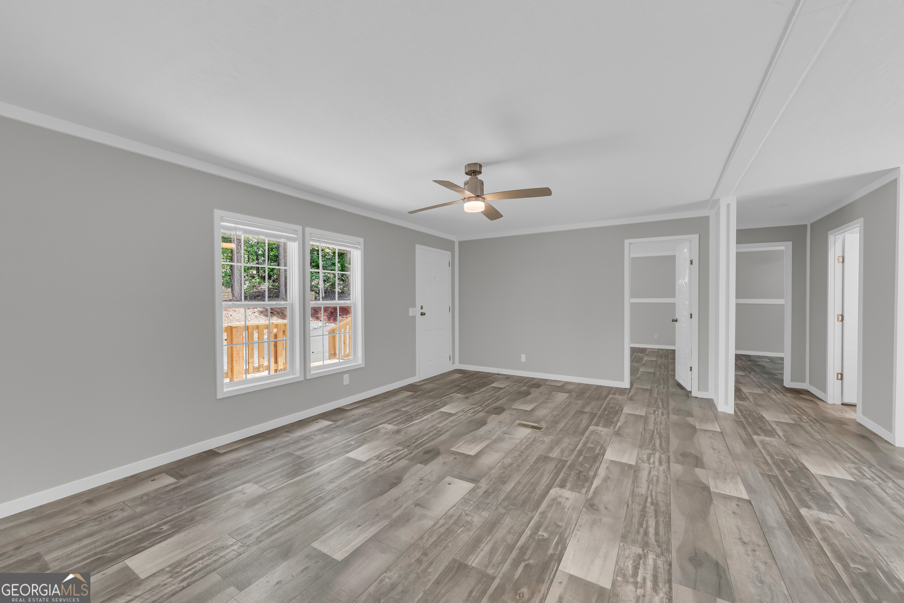 3442 Highway 29 Street South Colbert, GA 30628 - Photo 15 of 39 a view of an empty room with wooden floor and a window