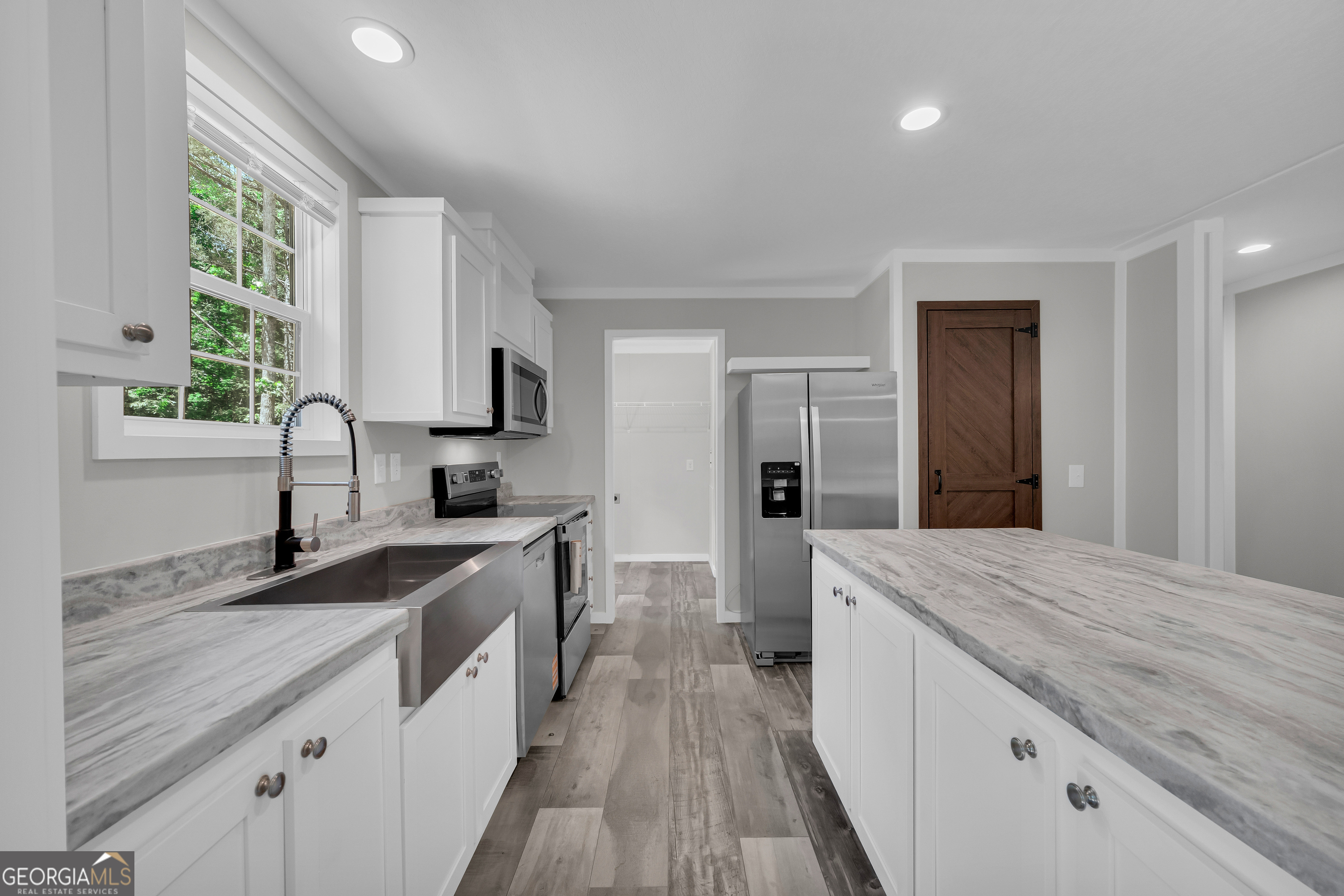 3442 Highway 29 Street South Colbert, GA 30628 - Photo 20 of 39 a large kitchen with a sink and cabinets