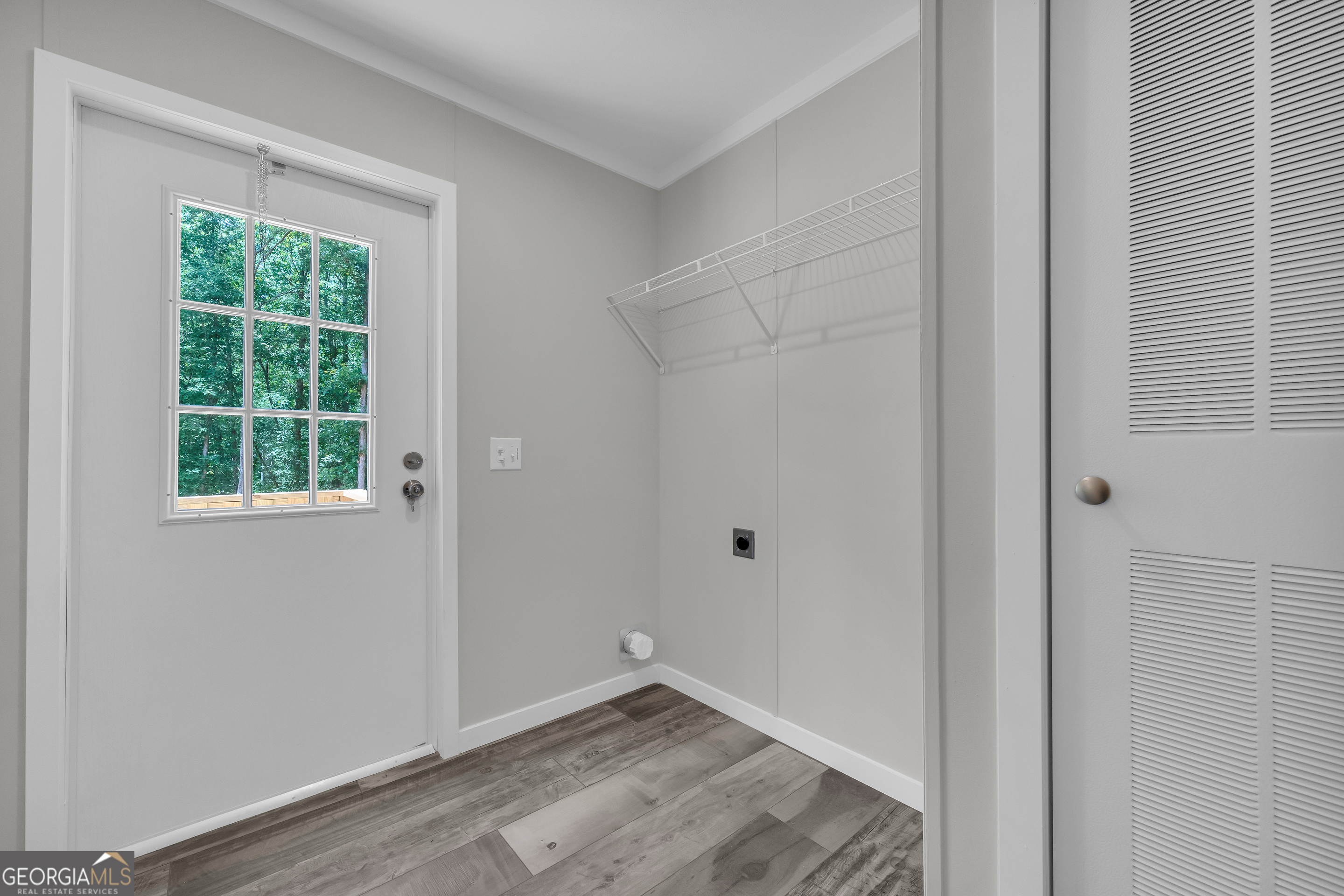 3442 Highway 29 Street South Colbert, GA 30628 - Photo 26 of 39 a view of an empty room with wooden floor and a window