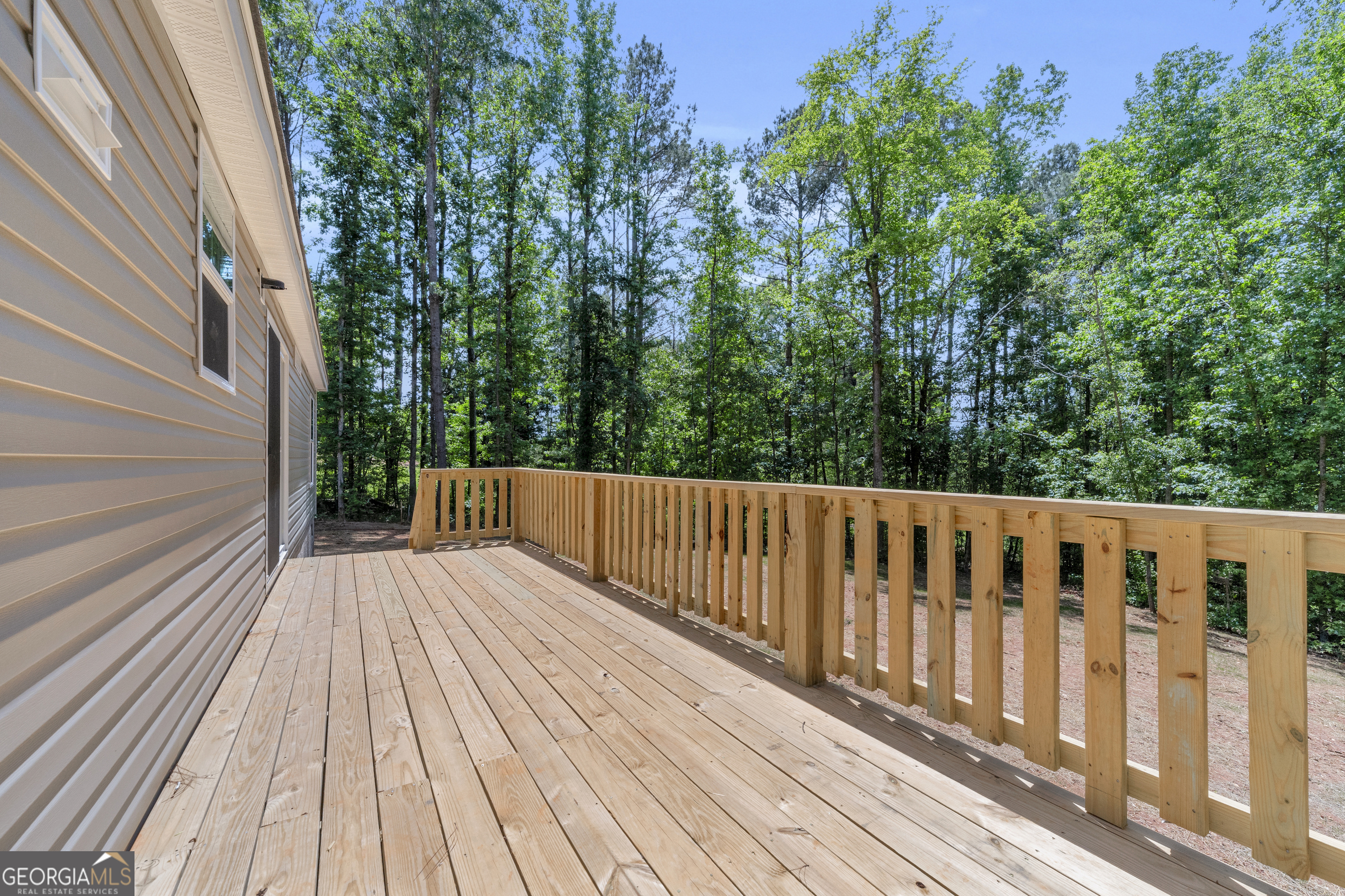 3442 Highway 29 Street South Colbert, GA 30628 - Photo 27 of 39 a balcony with wooden floor and trees in the back