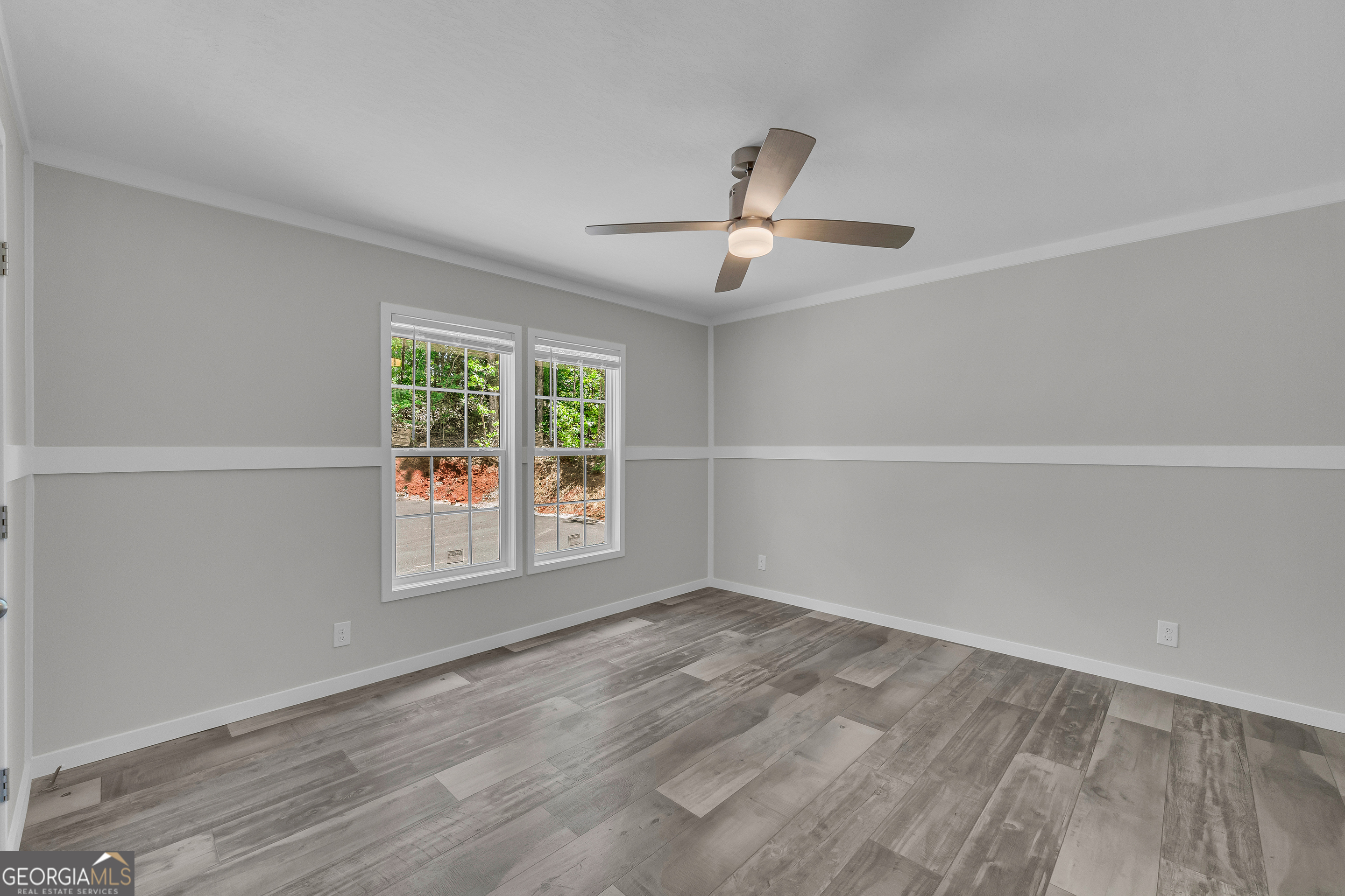 3442 Highway 29 Street South Colbert, GA 30628 - Photo 35 of 39 an empty room with wooden floor and windows