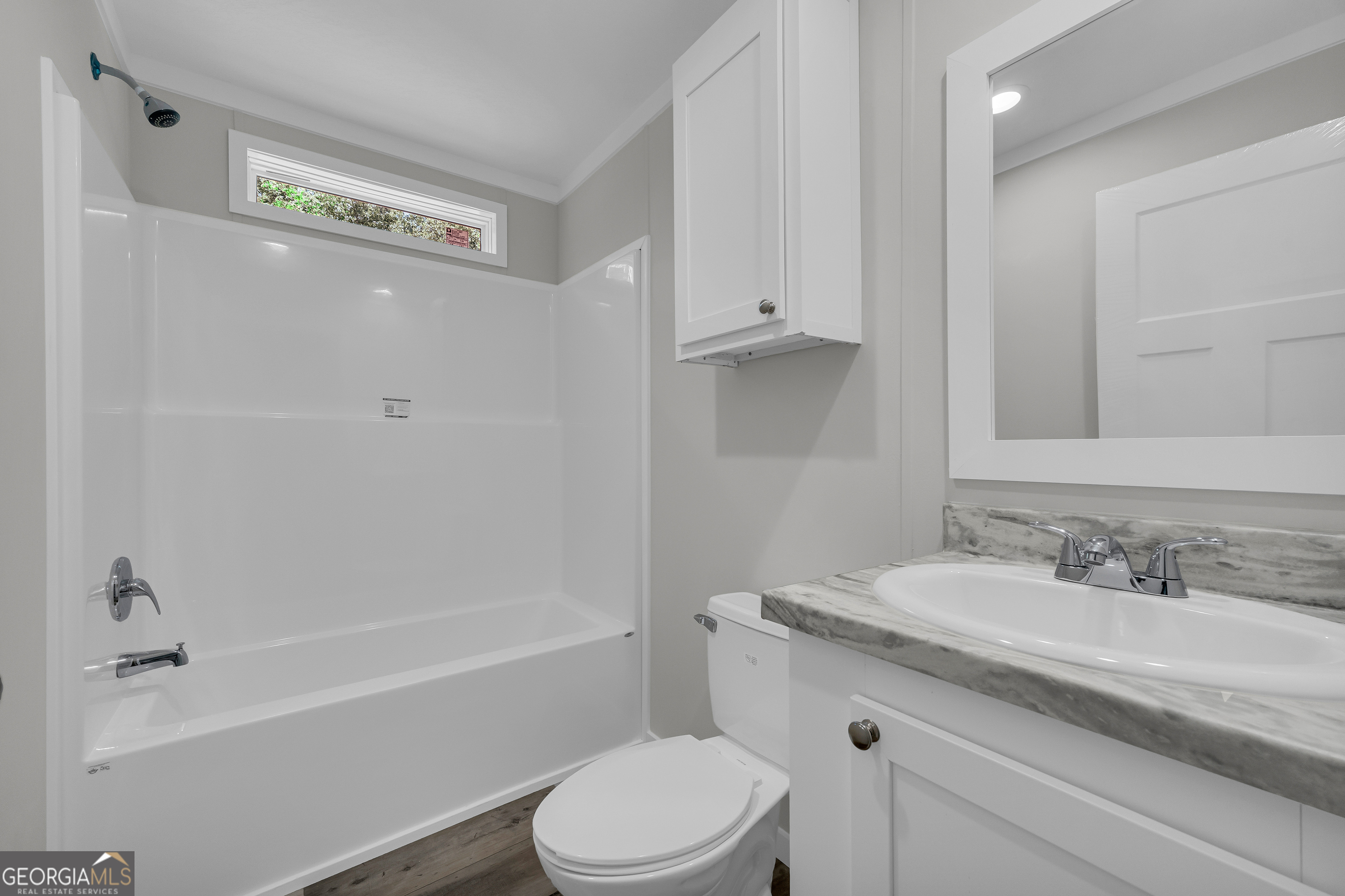 3442 Highway 29 Street South Colbert, GA 30628 - Photo 37 of 39 a bathroom with a granite countertop sink a toilet and shower