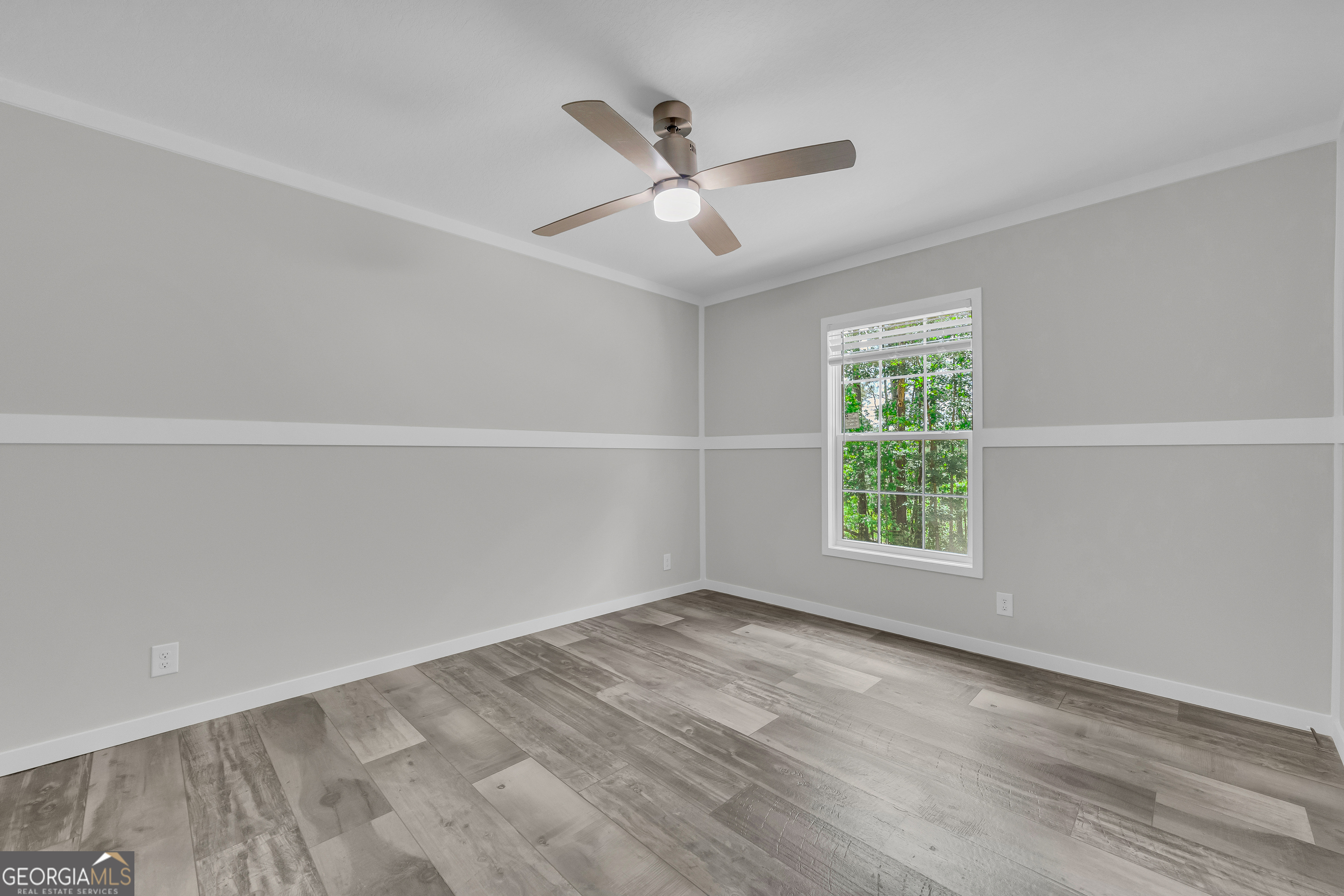 3442 Highway 29 Street South Colbert, GA 30628 - Photo 38 of 39 wooden floor in an empty room with a window