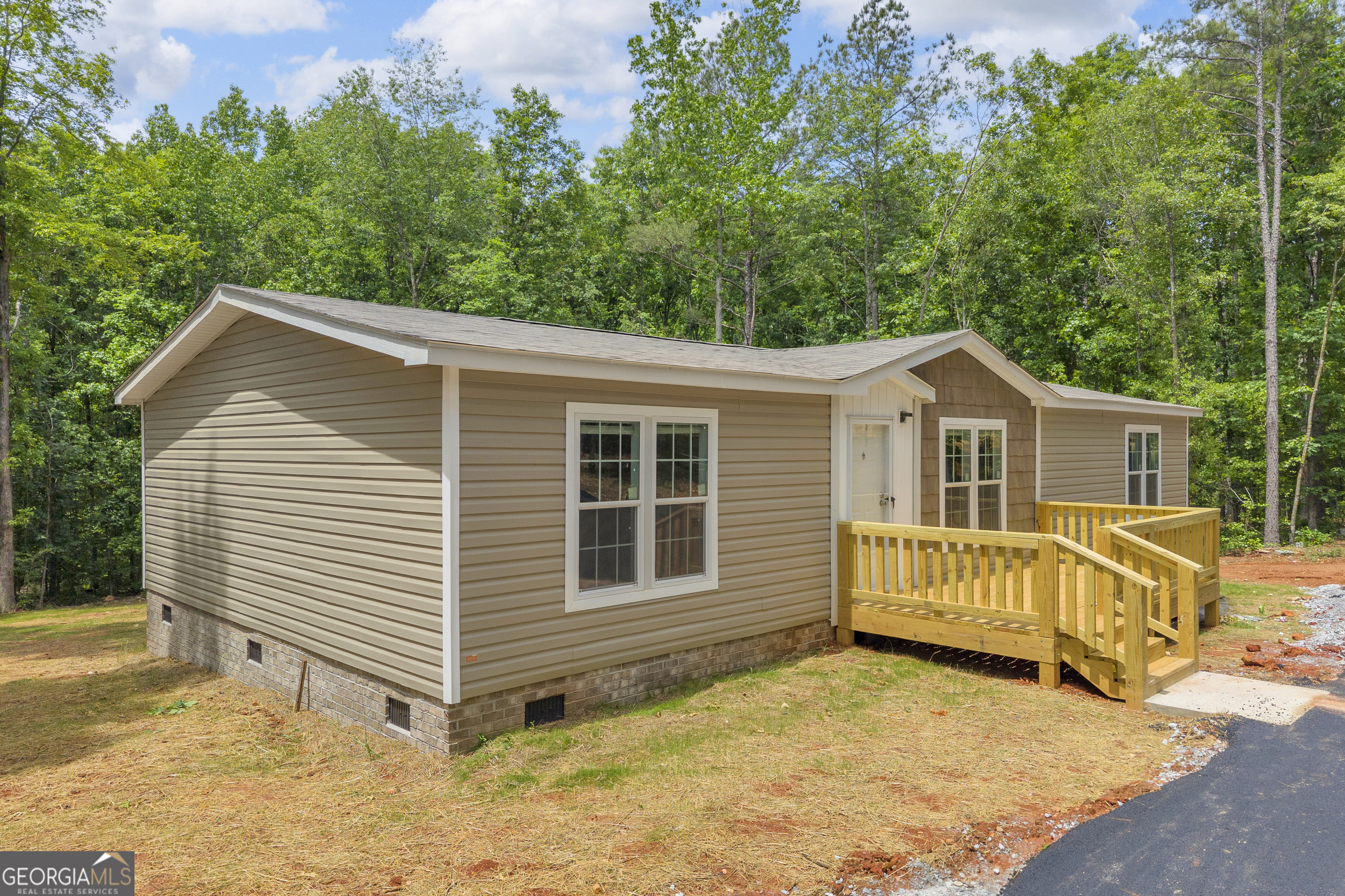 3442 Highway 29 Street South Colbert, GA 30628 - Photo 5 of 39 a view of a house with a yard and wooden fence