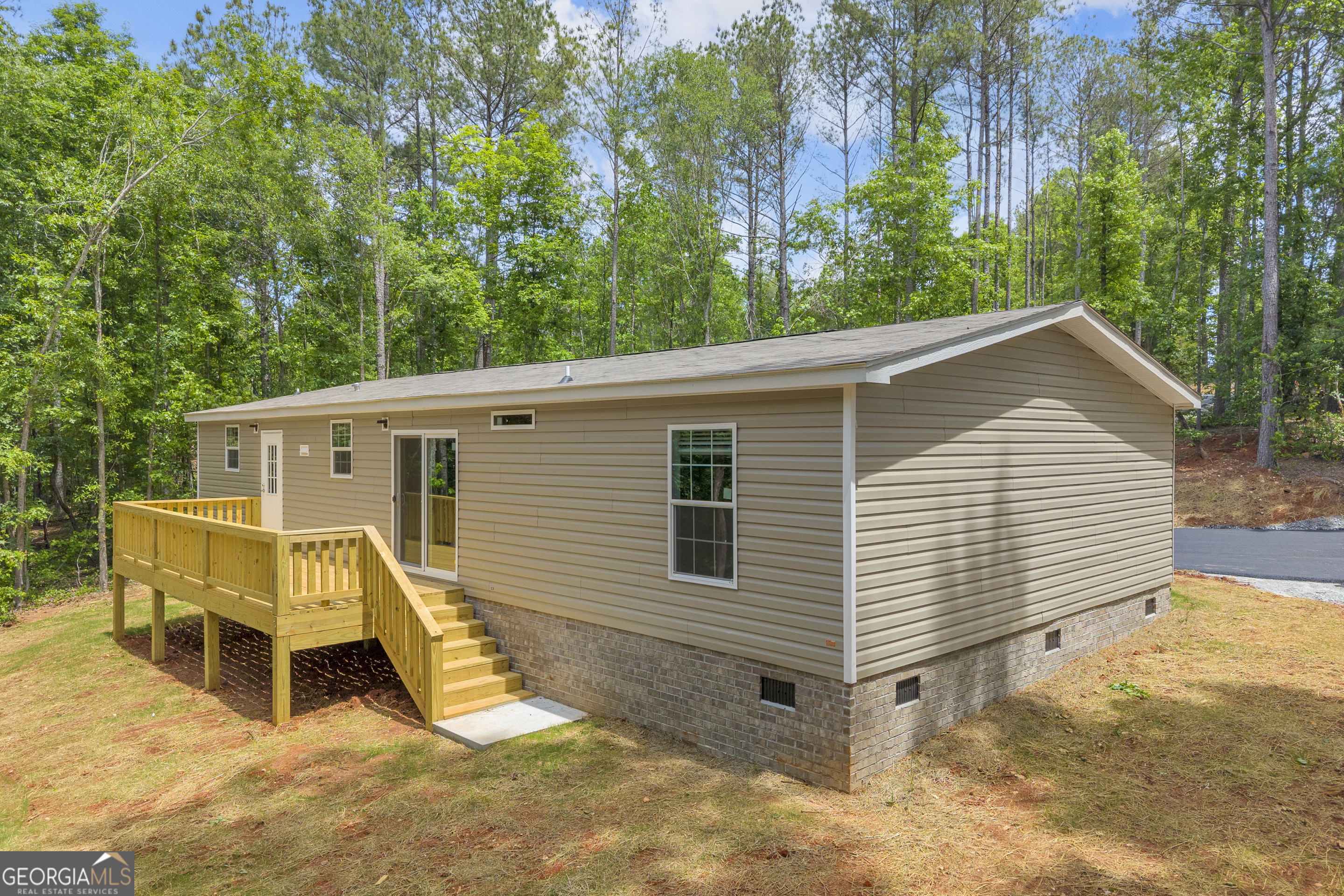 3442 Highway 29 Street South Colbert, GA 30628 - Photo 6 of 39 a view of a house with a yard chairs and a large tree