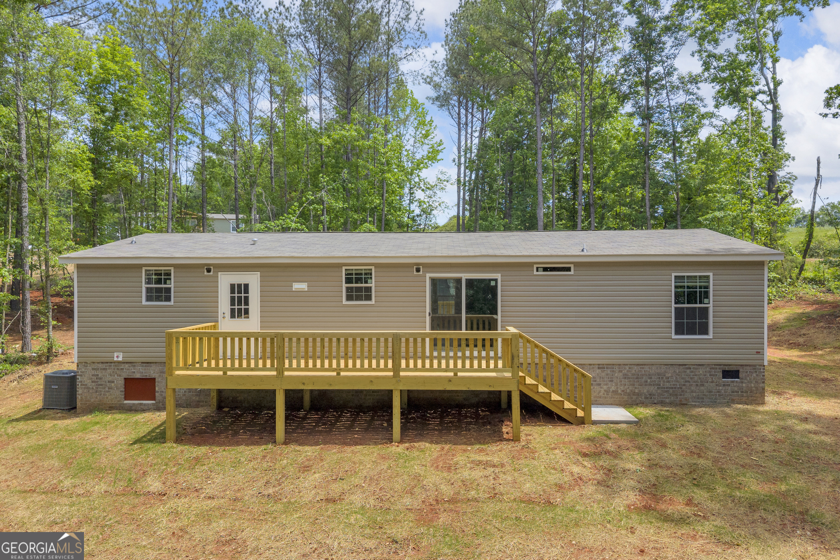 3442 Highway 29 Street South Colbert, GA 30628 - Photo 7 of 39 a view of a house with a backyard and a patio