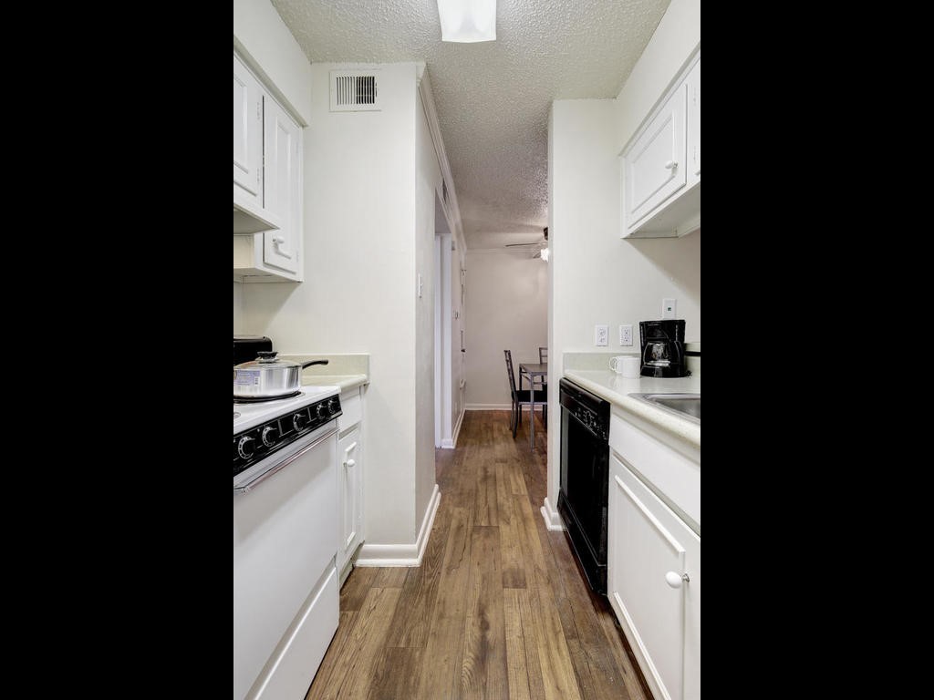4539 Guadalupe Street, Unit A207 Austin, TX 78751 - Photo 15 of 31 a view of a kitchen from the hallway