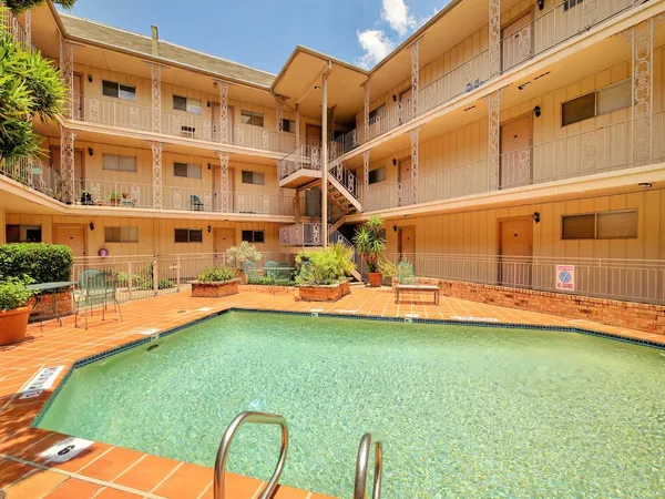 a view of a swimming pool with a lounge chairs