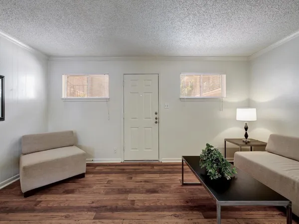 a living room with furniture and a lamp