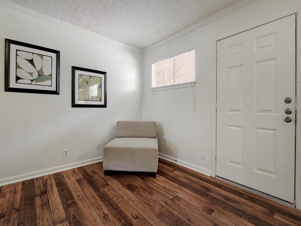 4539 Guadalupe Street, Unit A207 Austin, TX 78751 - Photo 8 of 31 a room with painting on the wall and a window