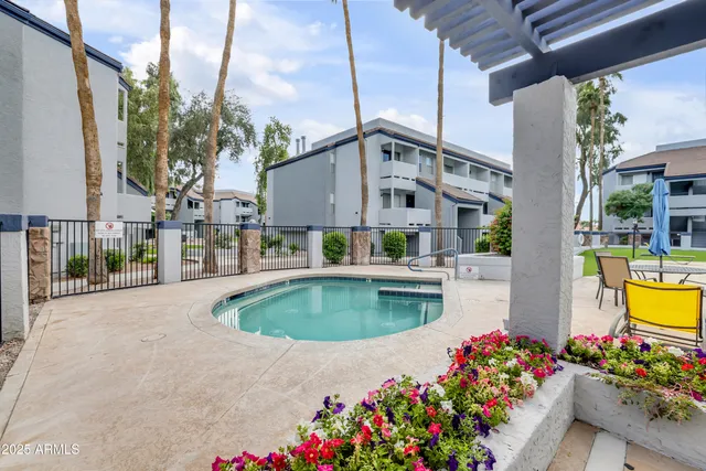a view of a swimming pool with a garden