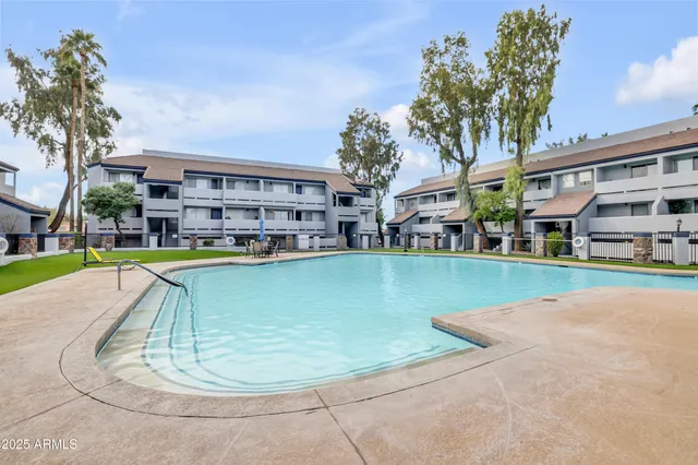 a view of house with outdoor seating and stairs
