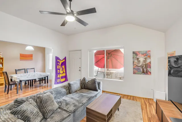 a view of a dining room with furniture and wooden floor