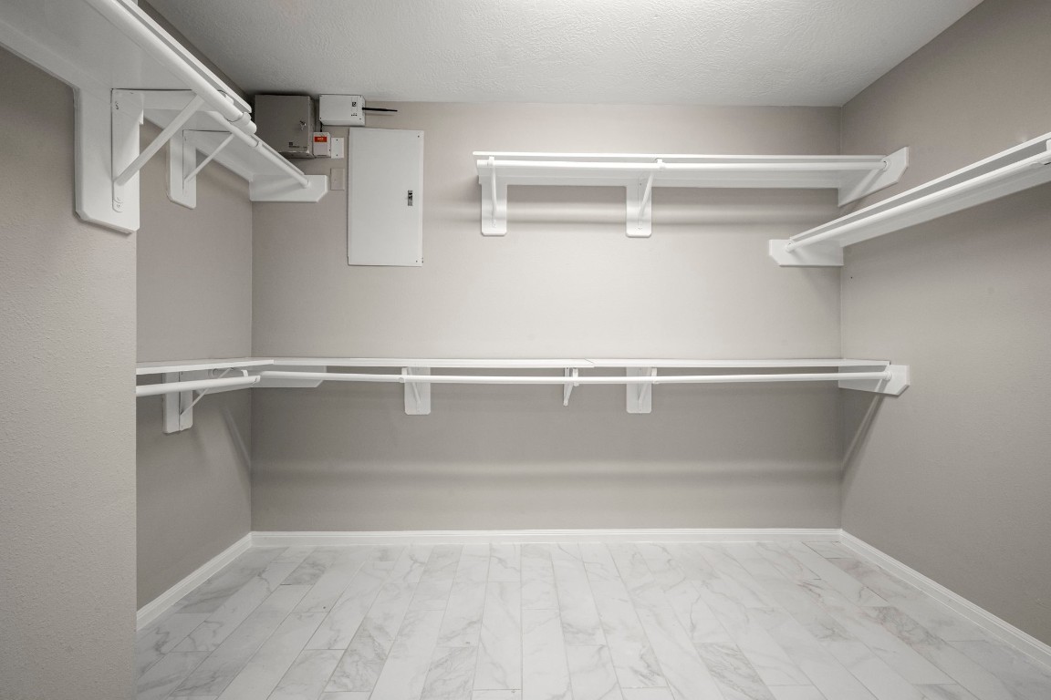 7 Delta Mill Court Conroe, TX 77385 - Photo 15 of 25 a view of a room with racks on the wall