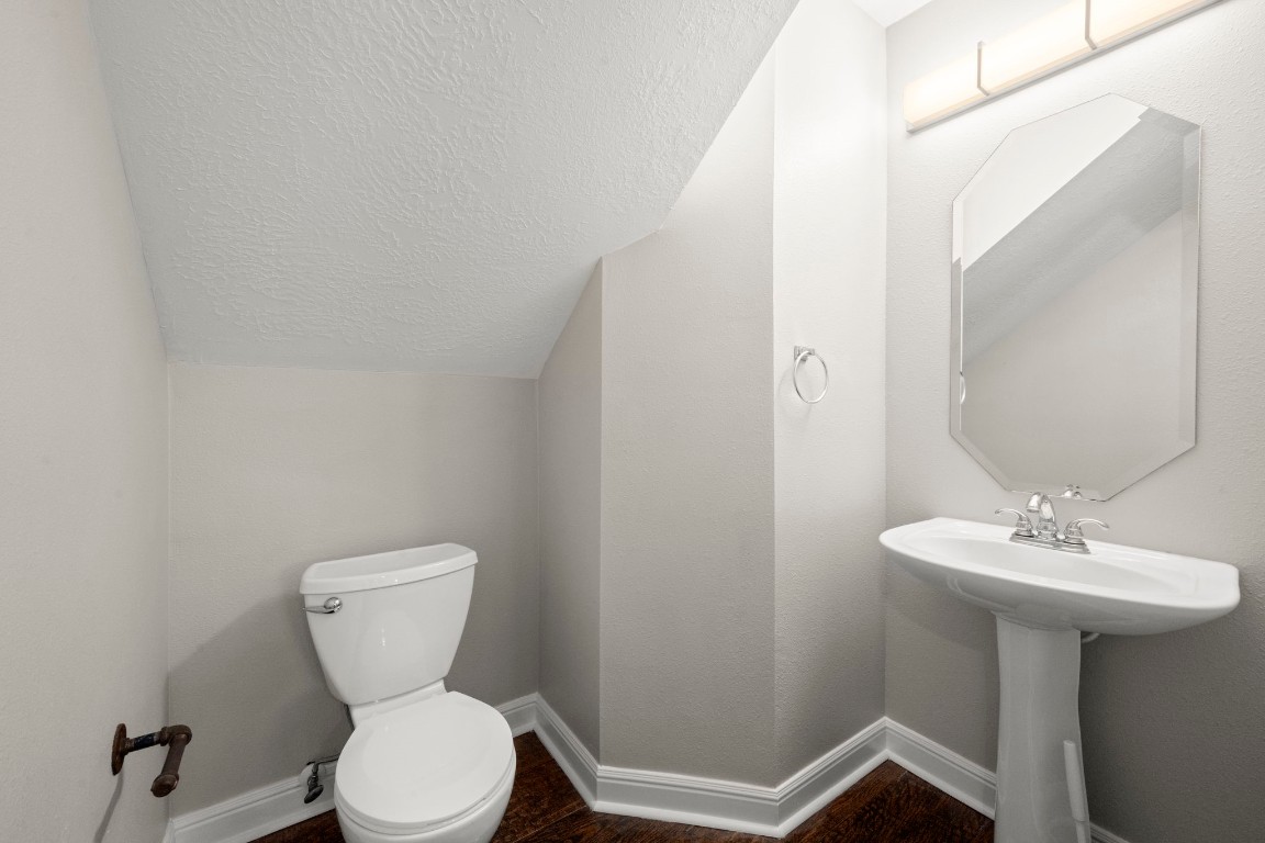 7 Delta Mill Court Conroe, TX 77385 - Photo 17 of 25 a bathroom with a sink toilet and a mirror