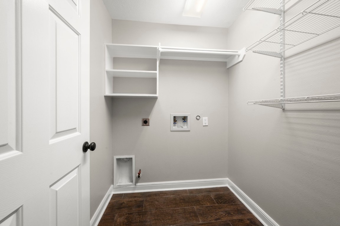 7 Delta Mill Court Conroe, TX 77385 - Photo 18 of 25 a view of storage and utility room with racks on the wall
