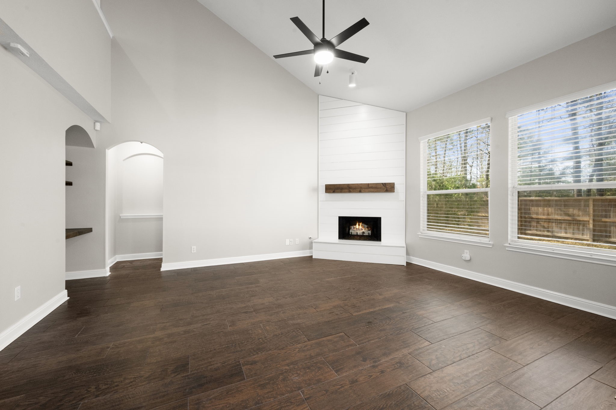 7 Delta Mill Court Conroe, TX 77385 - Photo 5 of 25 a view of an empty room with a window and fireplace