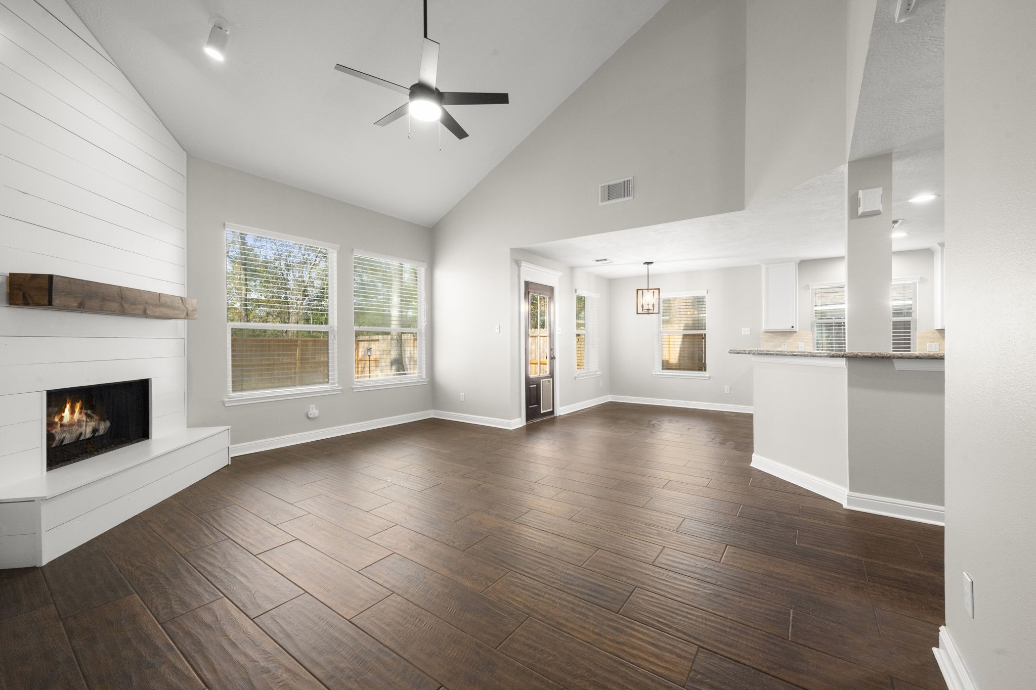 7 Delta Mill Court Conroe, TX 77385 - Photo 6 of 25 a view of an empty room with a fireplace and a window