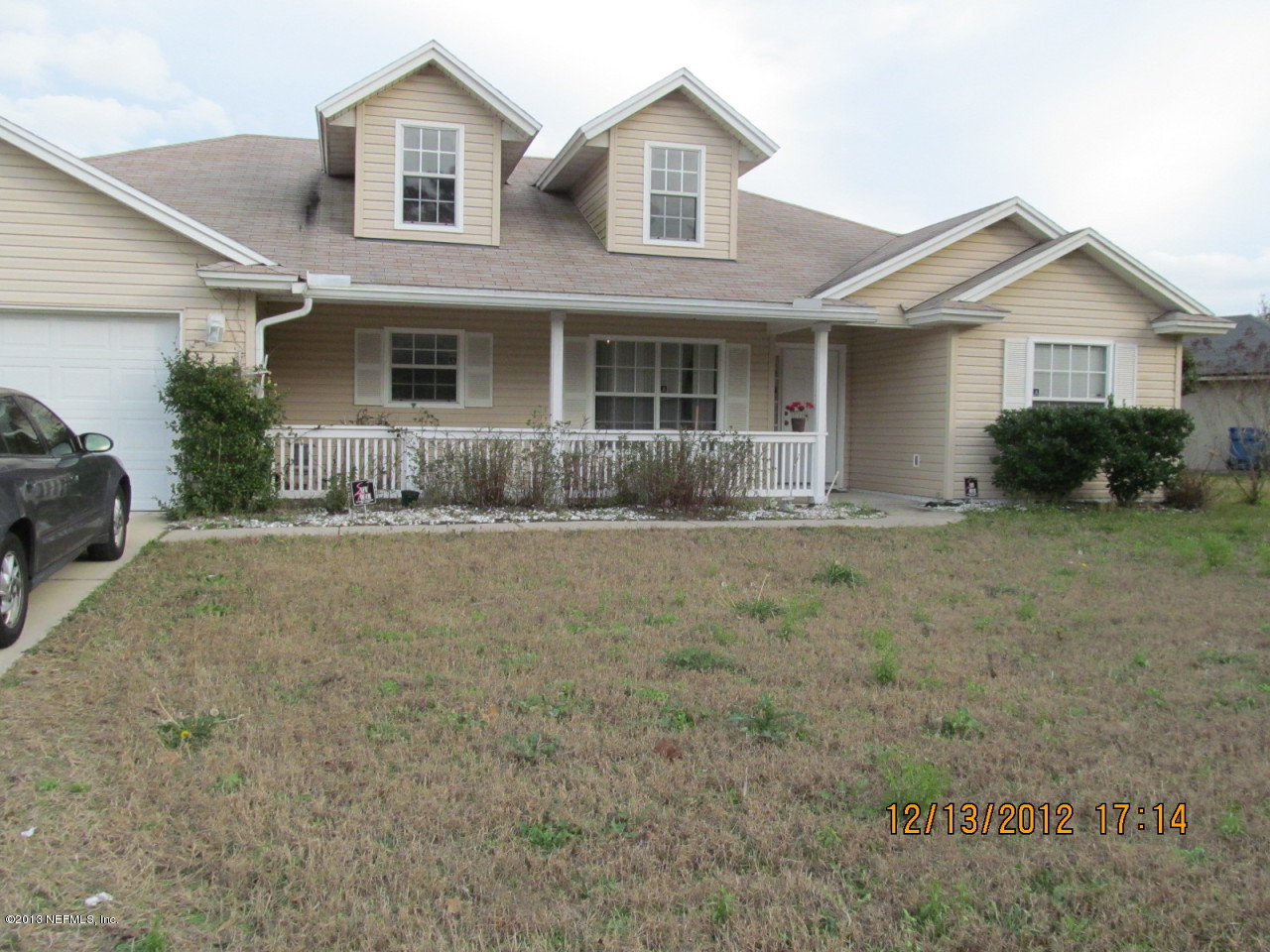 13919 Ridgewick Drive Jacksonville, FL 32218 - Photo 1 of 6 a front view of a house with a yard