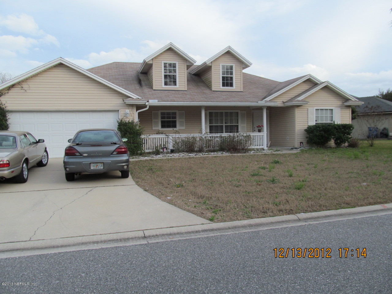 13919 Ridgewick Drive Jacksonville, FL 32218 - Photo 3 of 6 a front view of a house with a yard