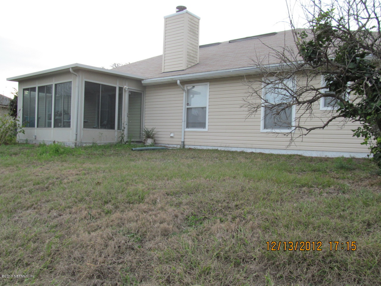 13919 Ridgewick Drive Jacksonville, FL 32218 - Photo 4 of 6 a house that has a backyard