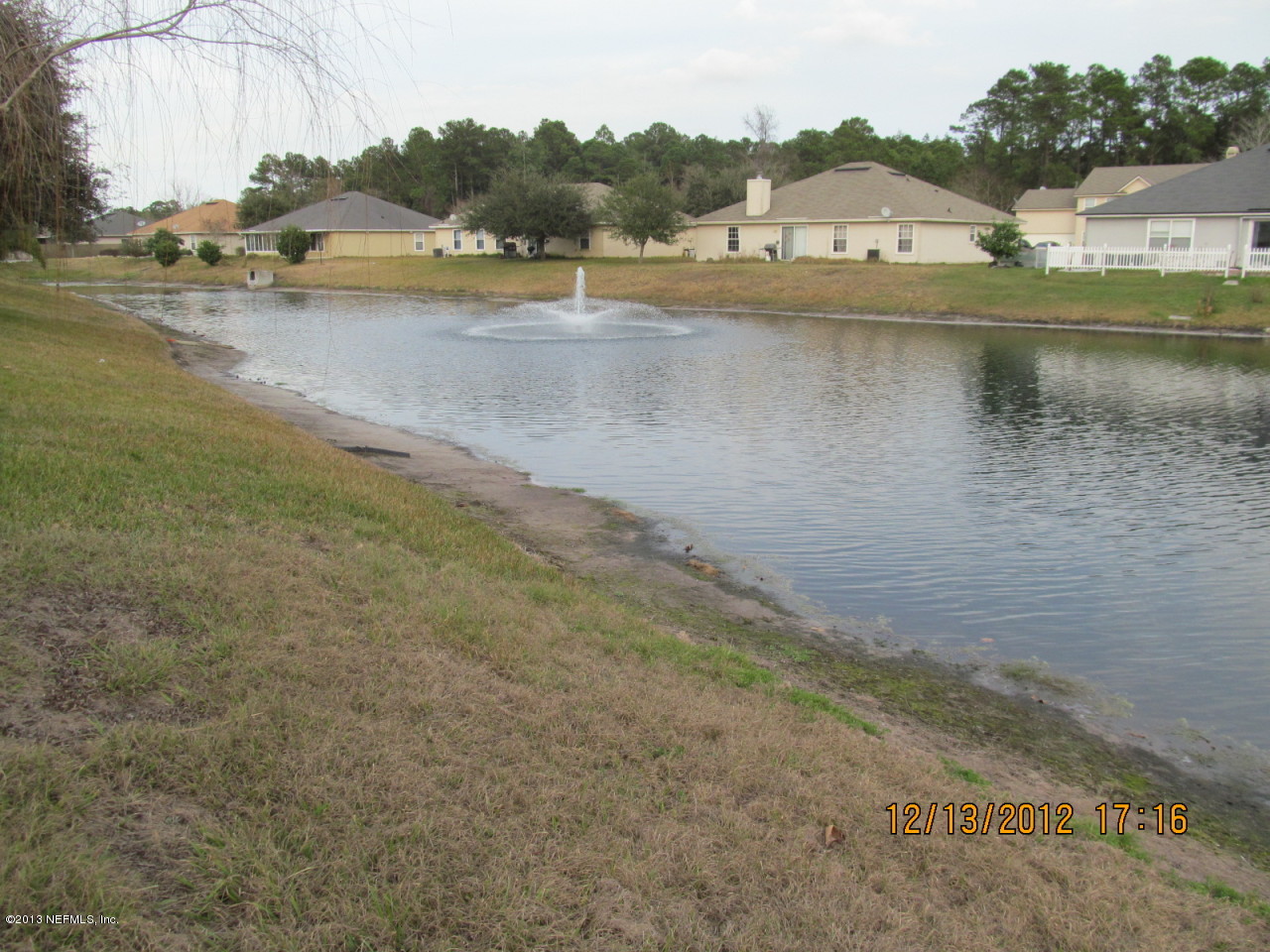 13919 Ridgewick Drive Jacksonville, FL 32218 - Photo 5 of 6 a view of a lake with houses