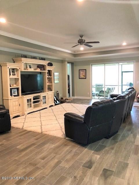 188 Antilles Road St. Augustine, FL 32092 - Photo 11 of 43 a living room with furniture and a flat screen tv