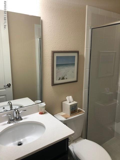 188 Antilles Road St. Augustine, FL 32092 - Photo 16 of 43 a bathroom with a sink mirror and toilet