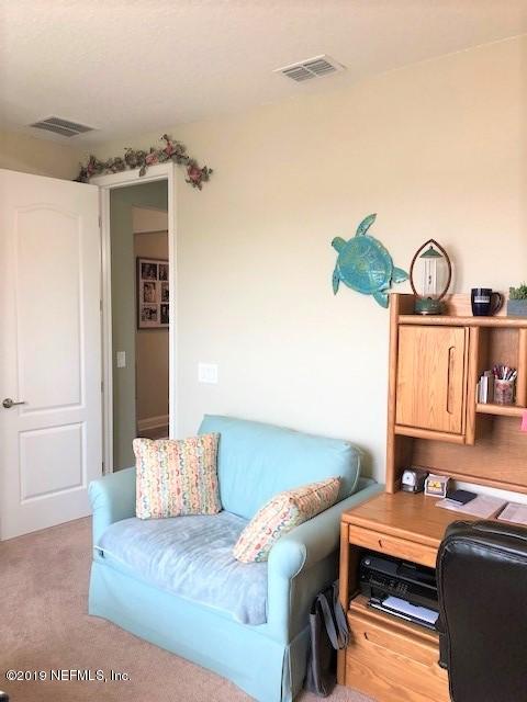 188 Antilles Road St. Augustine, FL 32092 - Photo 17 of 43 a living room with furniture and a window