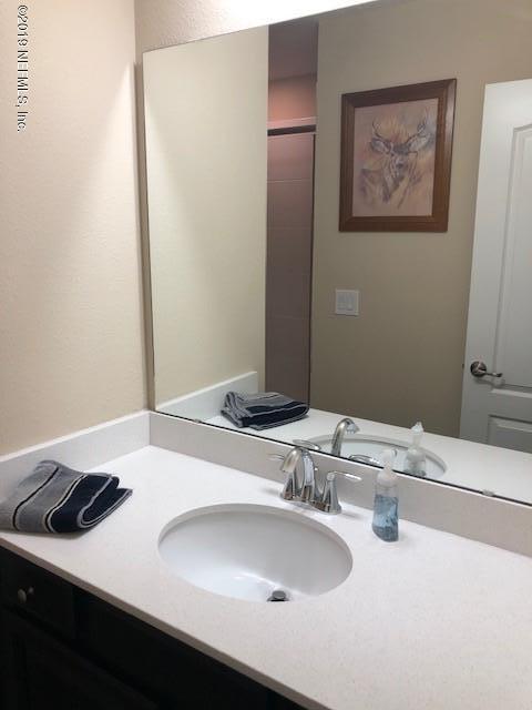 188 Antilles Road St. Augustine, FL 32092 - Photo 21 of 43 a bathroom with a sink and a mirror