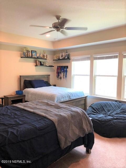 188 Antilles Road St. Augustine, FL 32092 - Photo 23 of 43 a bedroom with a bed and window