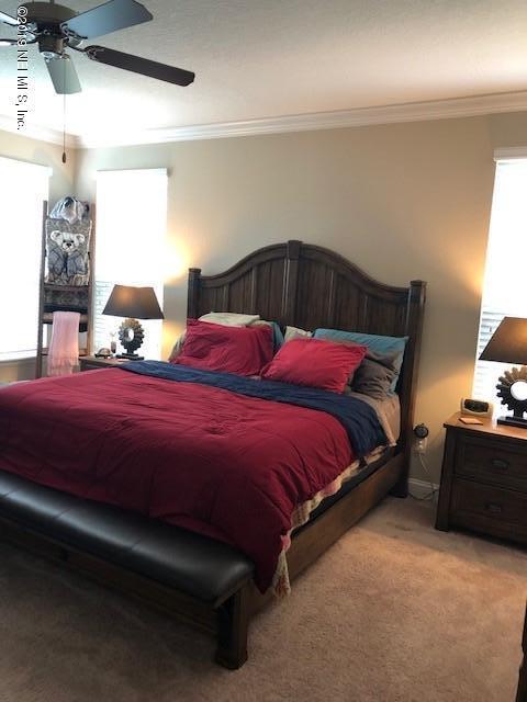 188 Antilles Road St. Augustine, FL 32092 - Photo 26 of 43 a bedroom with bed and window