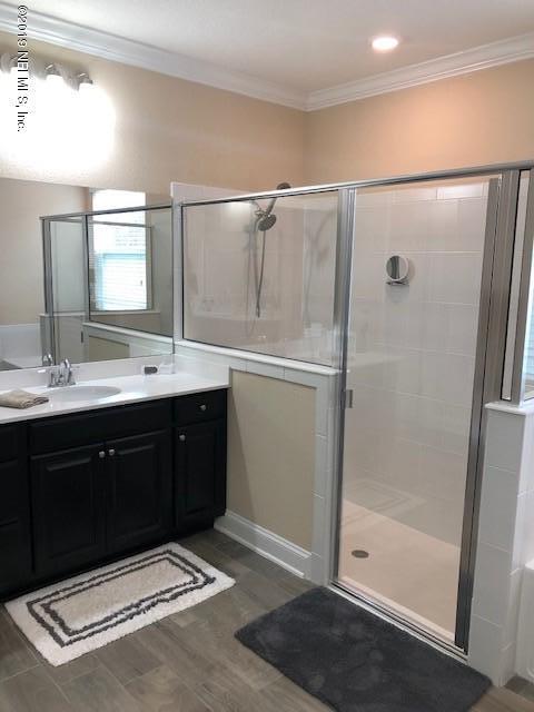 188 Antilles Road St. Augustine, FL 32092 - Photo 27 of 43 a spacious bathroom with a sink mirror and shower