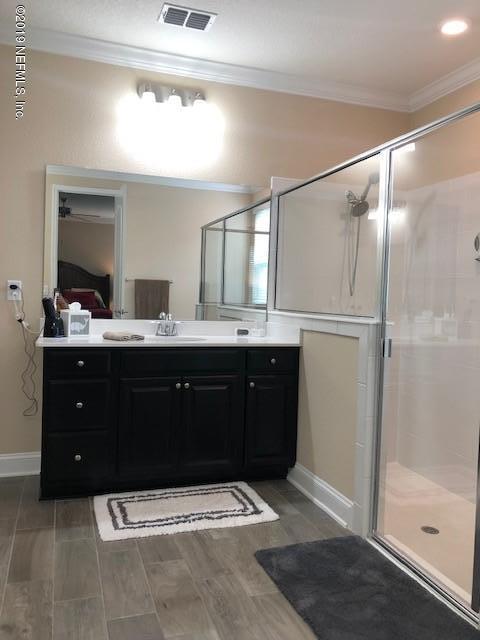 188 Antilles Road St. Augustine, FL 32092 - Photo 29 of 43 a bathroom with a sink and a mirror