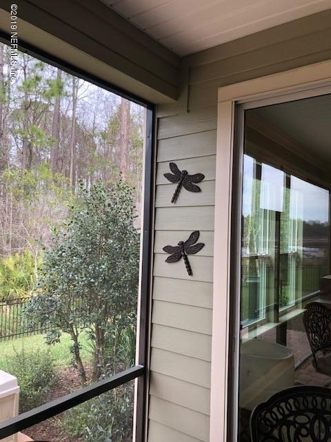 188 Antilles Road St. Augustine, FL 32092 - Photo 34 of 43 a view of a balcony and a floor to ceiling window wooden floor