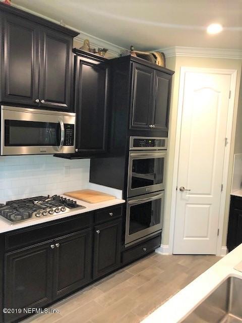 188 Antilles Road St. Augustine, FL 32092 - Photo 8 of 43 a kitchen with granite countertop cabinets and steel stainless steel appliances