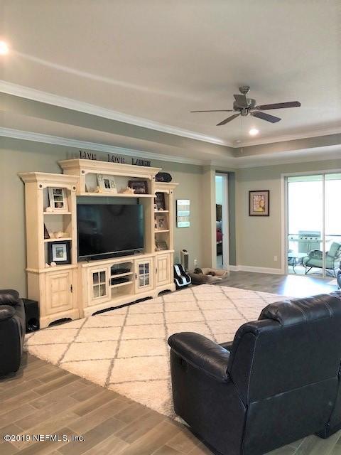 188 Antilles Road St. Augustine, FL 32092 - Photo 10 of 43 a living room with furniture and a flat screen tv