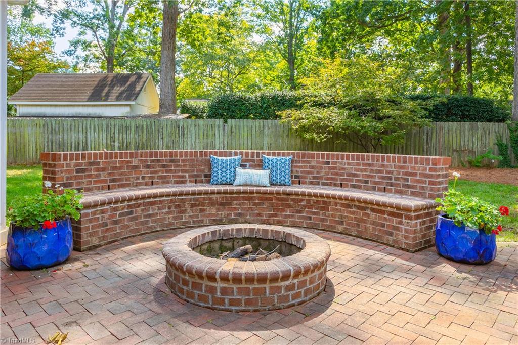 1607 Beechtree Road Greensboro, NC 27408 - Photo 38 of 47 Fire pit with built in seating