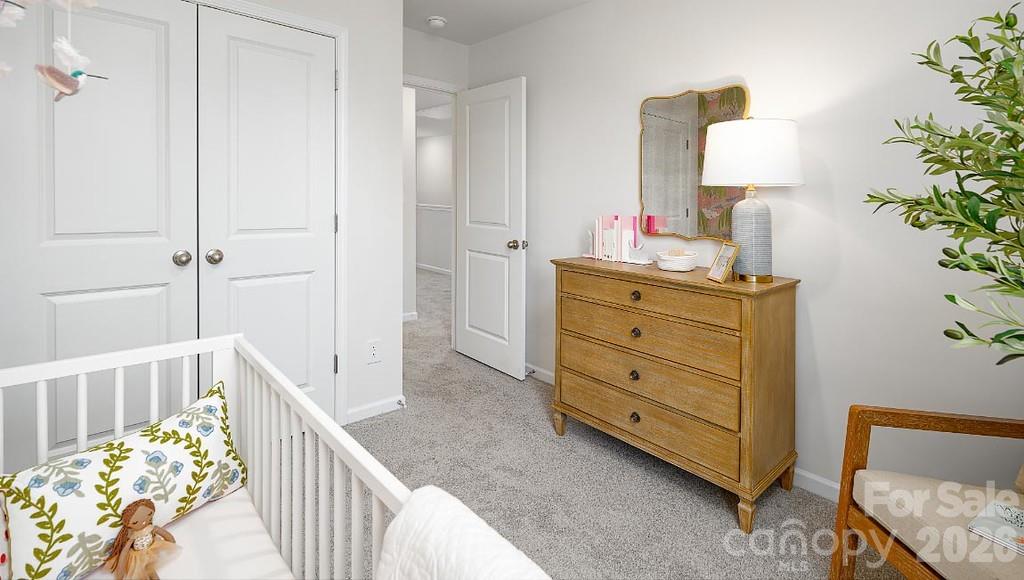 3281 Ora Smith Road Lincolnton, NC 28092 - Photo 20 of 30 a bedroom with a bed and a lamp on dresser