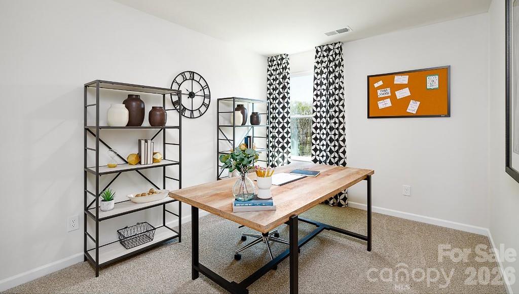 3281 Ora Smith Road Lincolnton, NC 28092 - Photo 21 of 30 a view of a room that has a table and a potted plant on a table