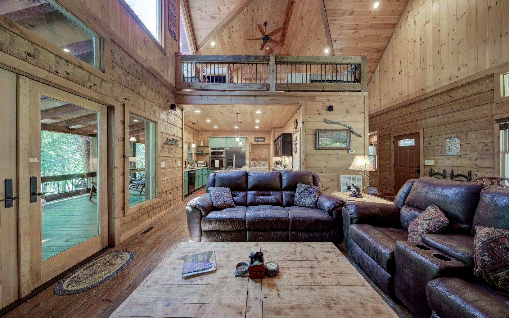 15 Kiki's River Road Blue Ridge, GA 30513 - Photo 11 of 32 a living room with furniture ceiling fan and a rug