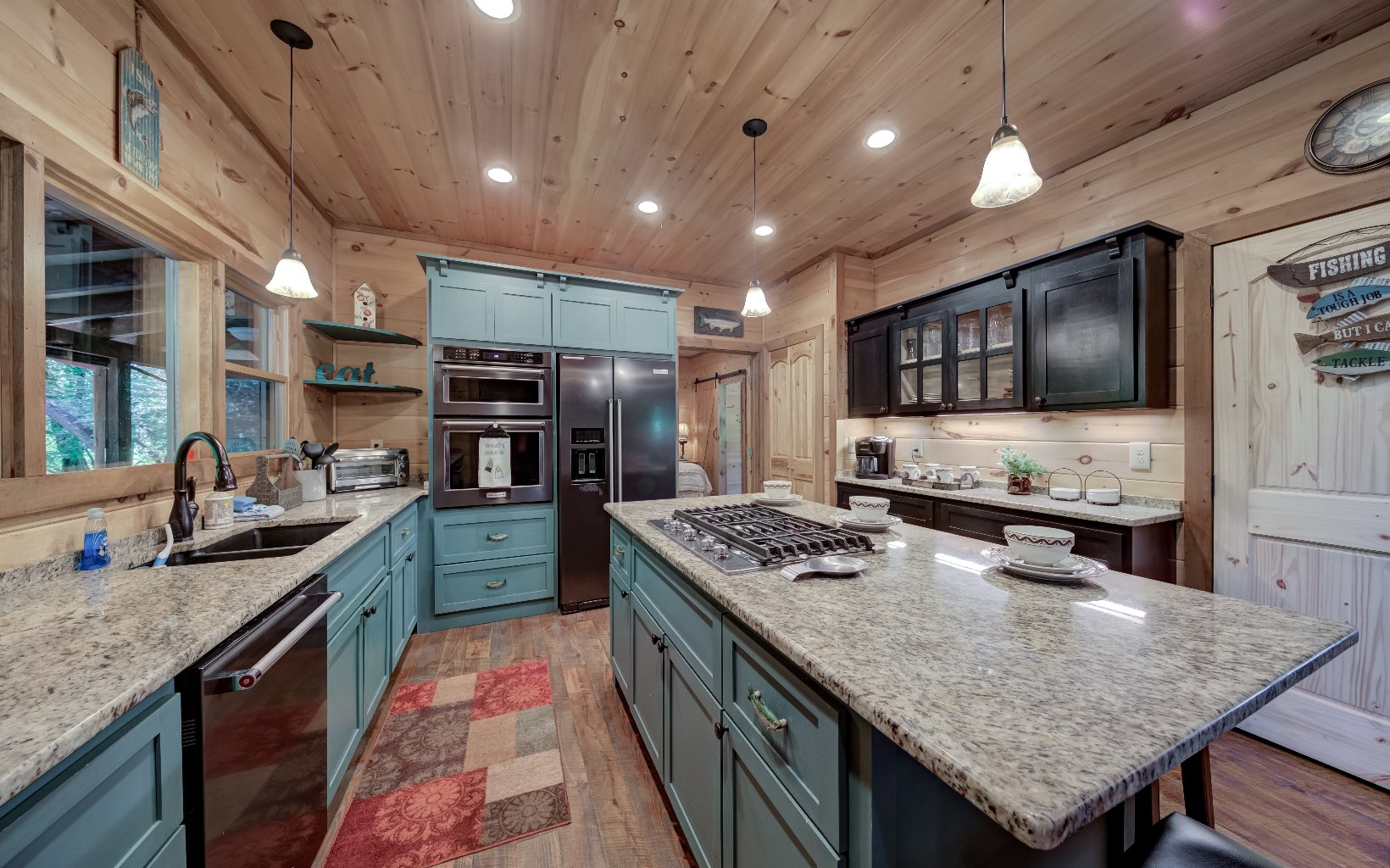 15 Kiki's River Road Blue Ridge, GA 30513 - Photo 13 of 32 a kitchen with stainless steel appliances granite countertop a sink stove and refrigerator