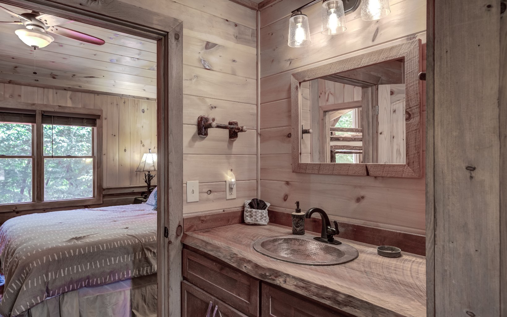 15 Kiki's River Road Blue Ridge, GA 30513 - Photo 28 of 32 a bathroom with a granite countertop sink a large mirror and shower