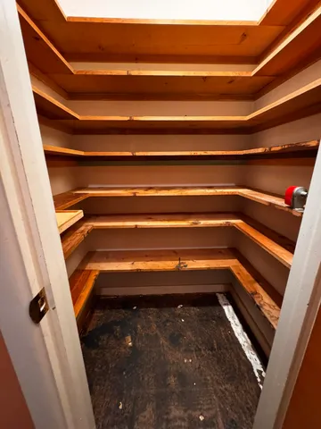 a refrigerator in an empty room