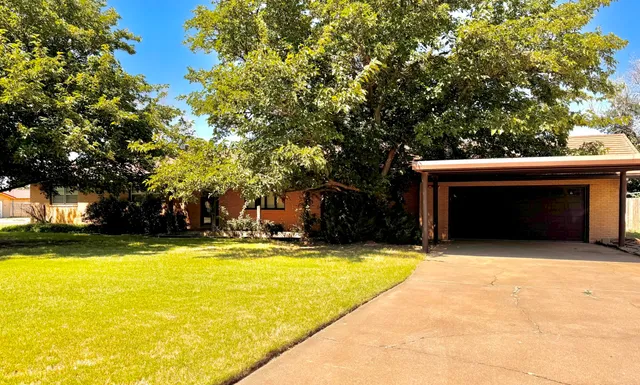 a view of swimming pool with trees in the background