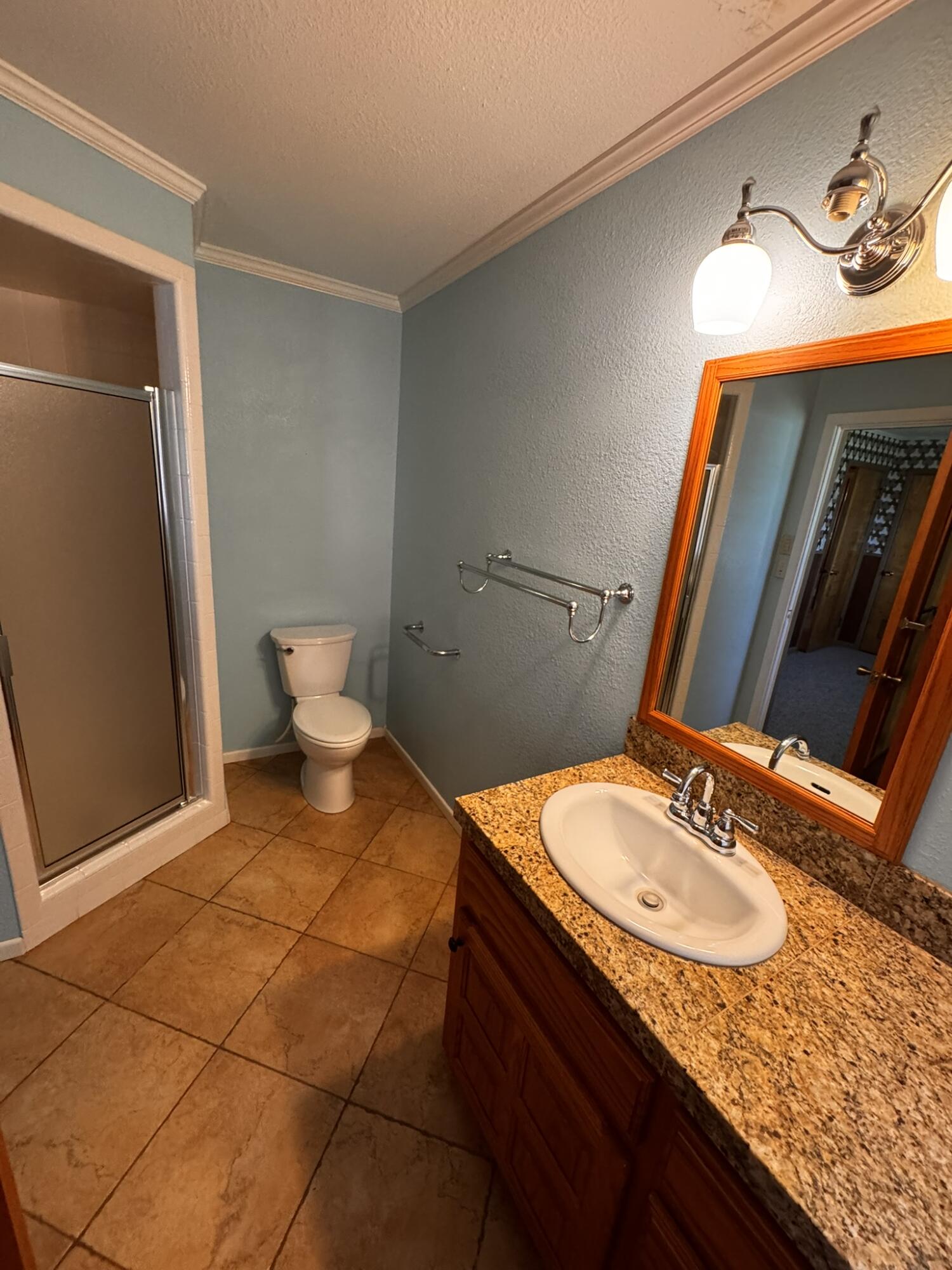 701 Zephyr Plainview, TX 79072 - Photo 26 of 29 a bathroom with a sink and a mirror