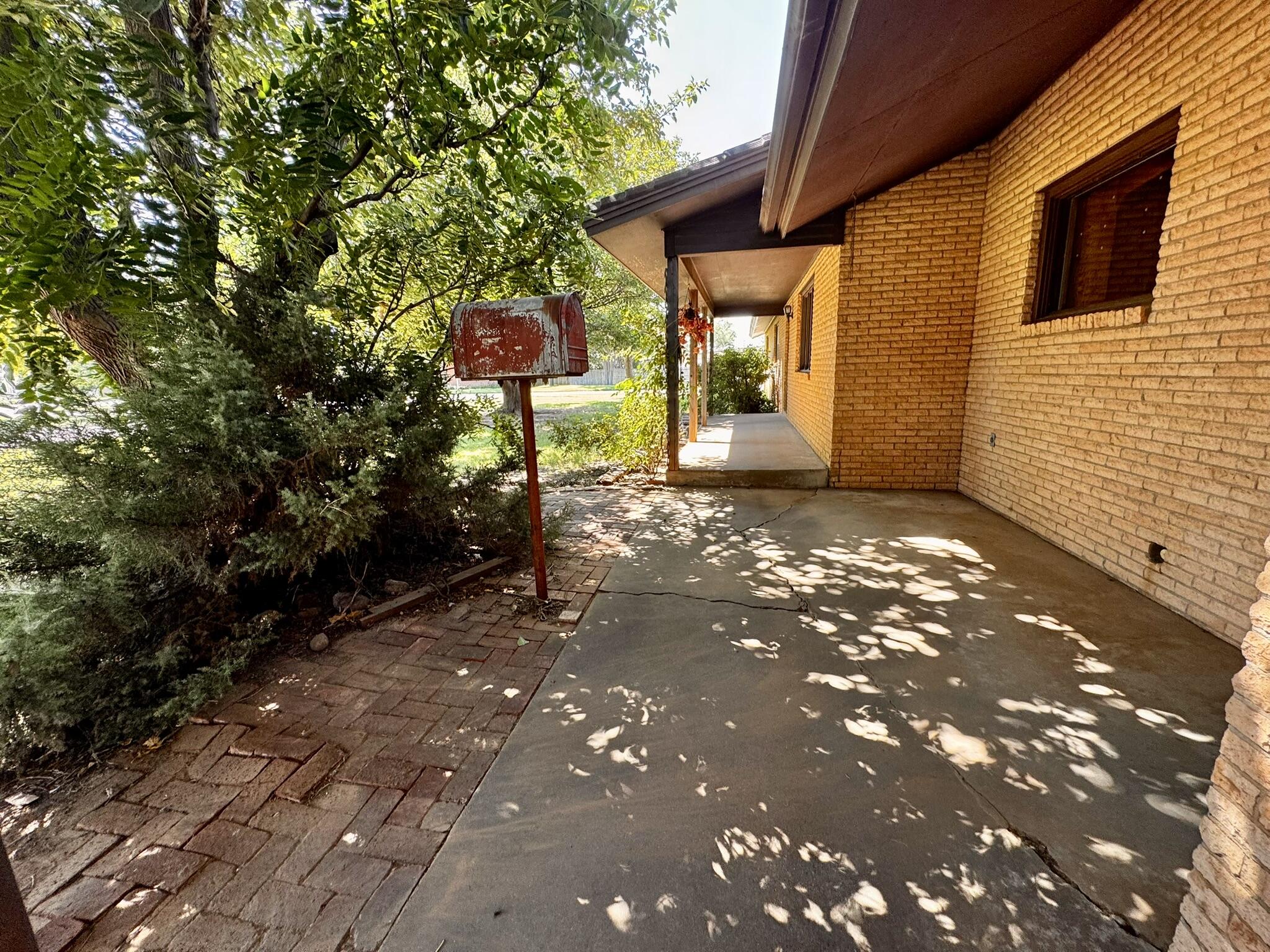 701 Zephyr Plainview, TX 79072 - Photo 5 of 29 a backyard of a house with seating space