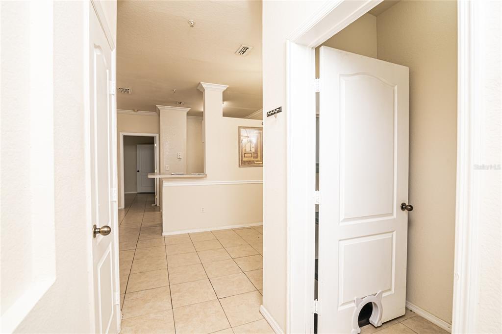 3391 South Kirkman Road, Unit 1216 Orlando, FL 32811 - Photo 3 of 33 a view of a kitchen with a refrigerator and a window