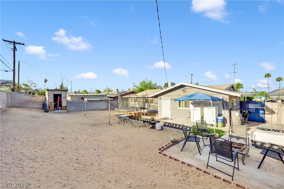 2221 Englestad Street North Las Vegas, NV 89030 - Photo 29 of 32 A spacious private yard offers abundant outdoor living potential for leisure and recreation.