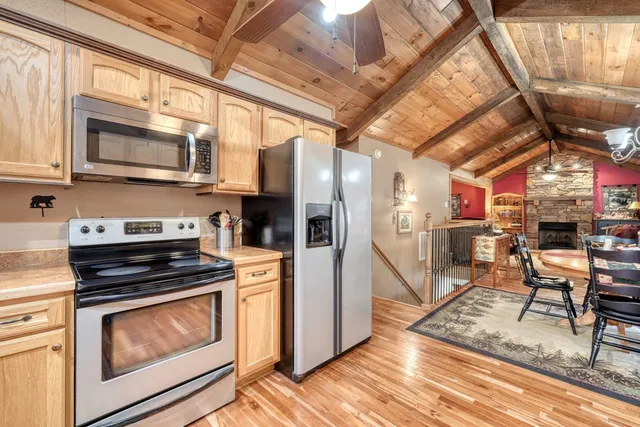 a kitchen with granite countertop a sink and cabinets